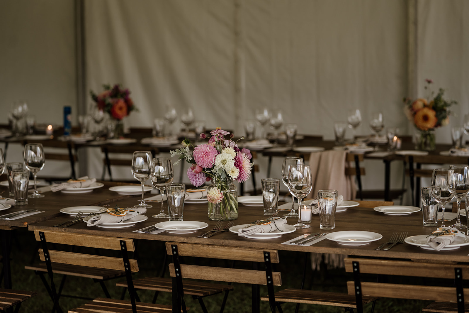 Marquee wedding reception at Politini Wines. Outdoor wedding reception. Floral centerpiece by Flowers by Lindy, Albury. 