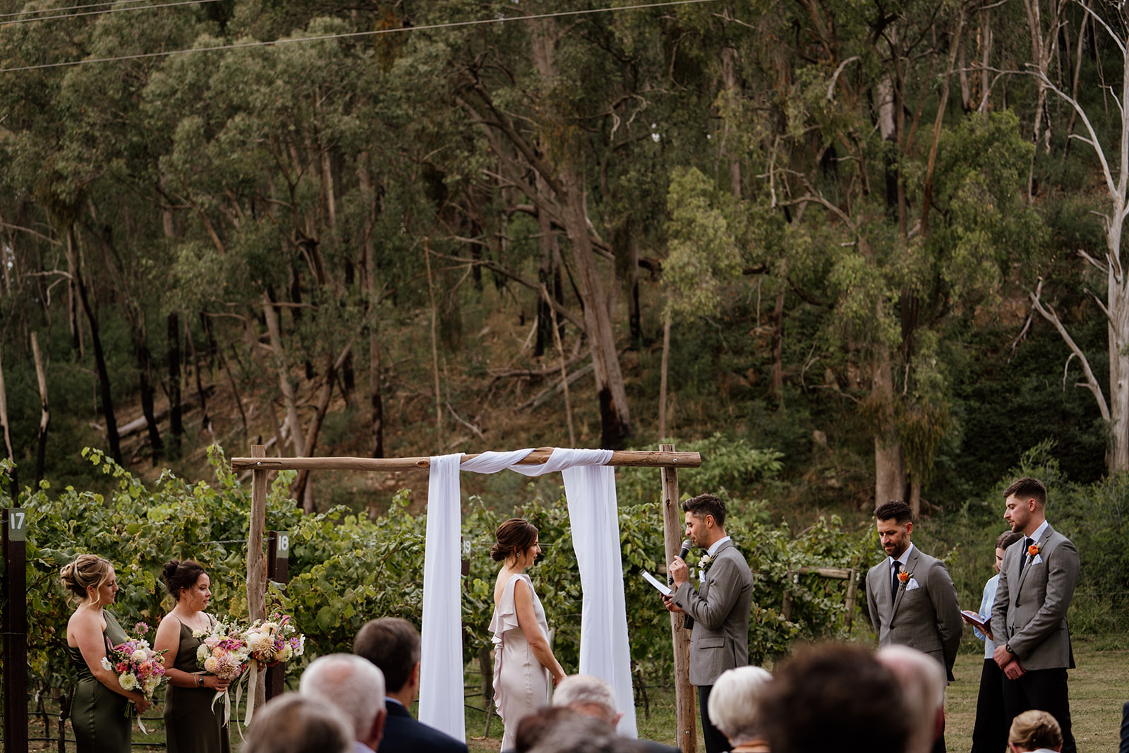 Wedding ceremony amongst the gum trees and vineyards at Politini Wines. Outdoor wedding ceremony at Politini Wines.