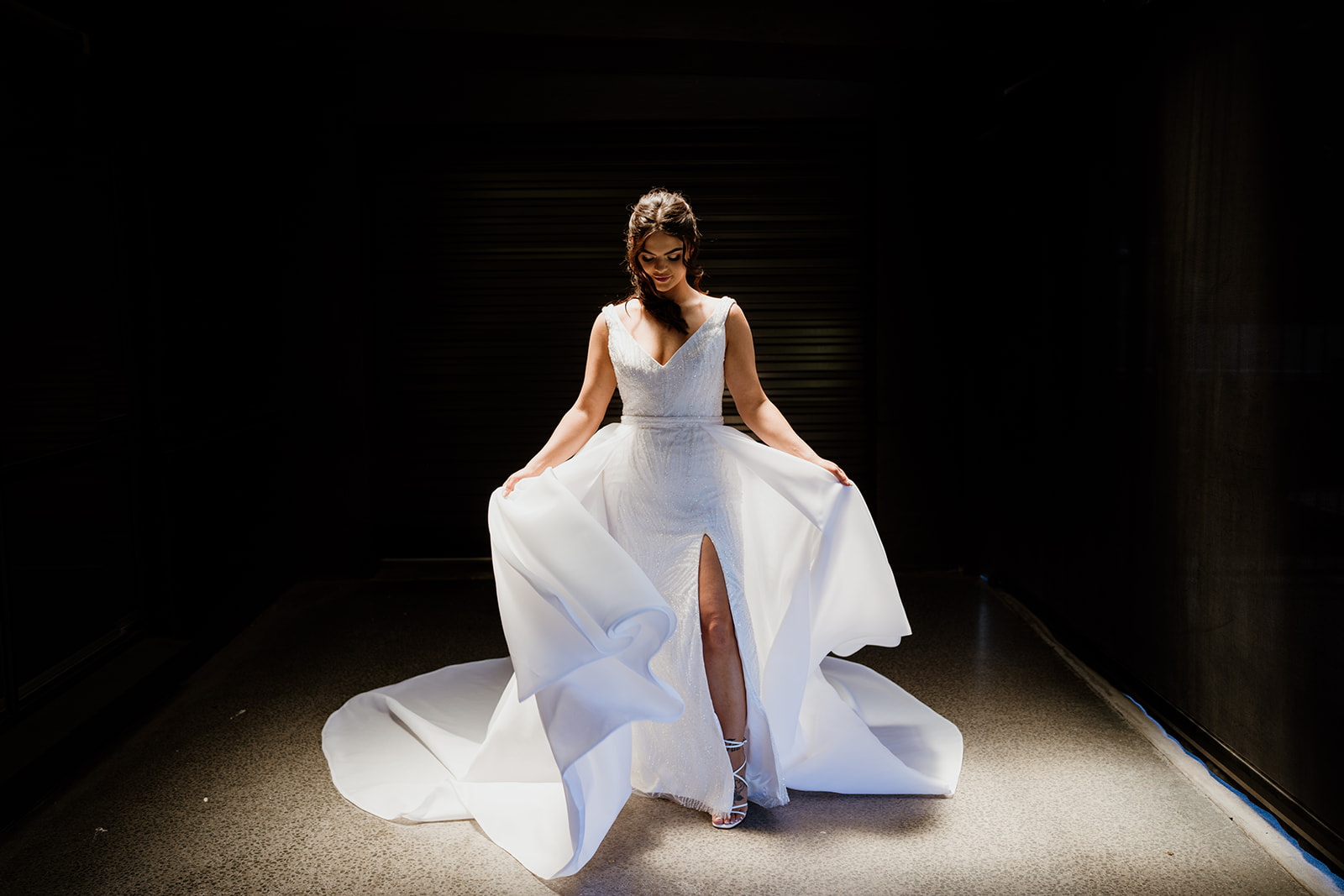 Jillian Franklin Couture wedding dress. Bridal dress by Jillian Franklin Couture. Sleeveless wedding dress with slit. 
