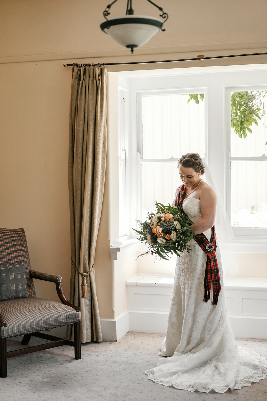 Bride getting ready at Brown Brothers Bridal Cottage. Brown Brothers Bridal Cottage. Scottish wedding. Bridal portrait.