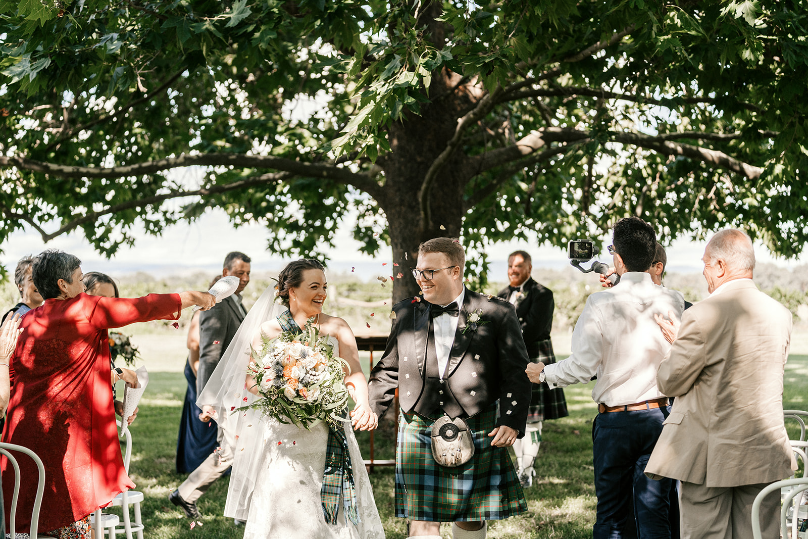 Brown Brothers wedding ceremony. Under the oak tree wedding ceremony at Brown Brothers, Milawa. Scottish style wedding.