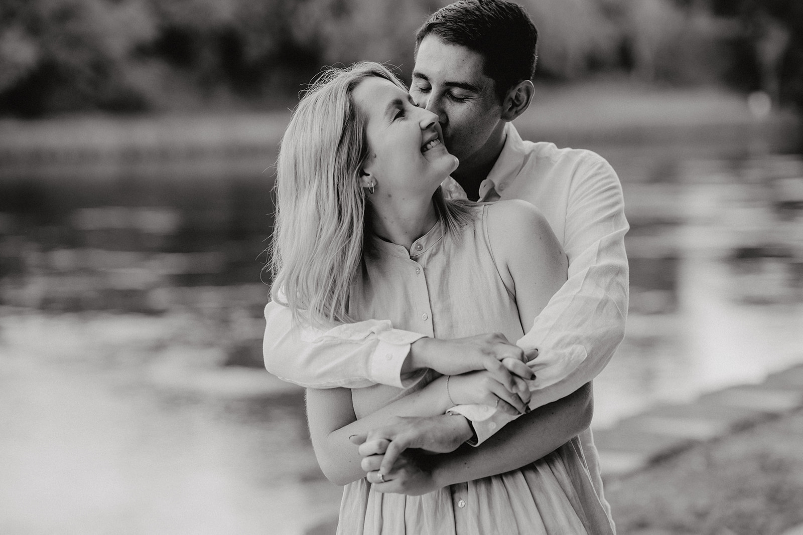 A couple hugging during an engagement photoshoot with haley adele photography