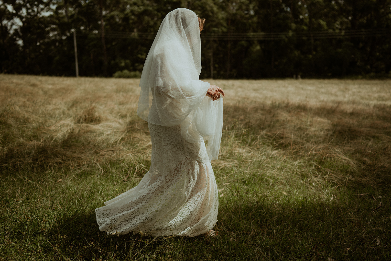 Bride, wearing a long flowing veil