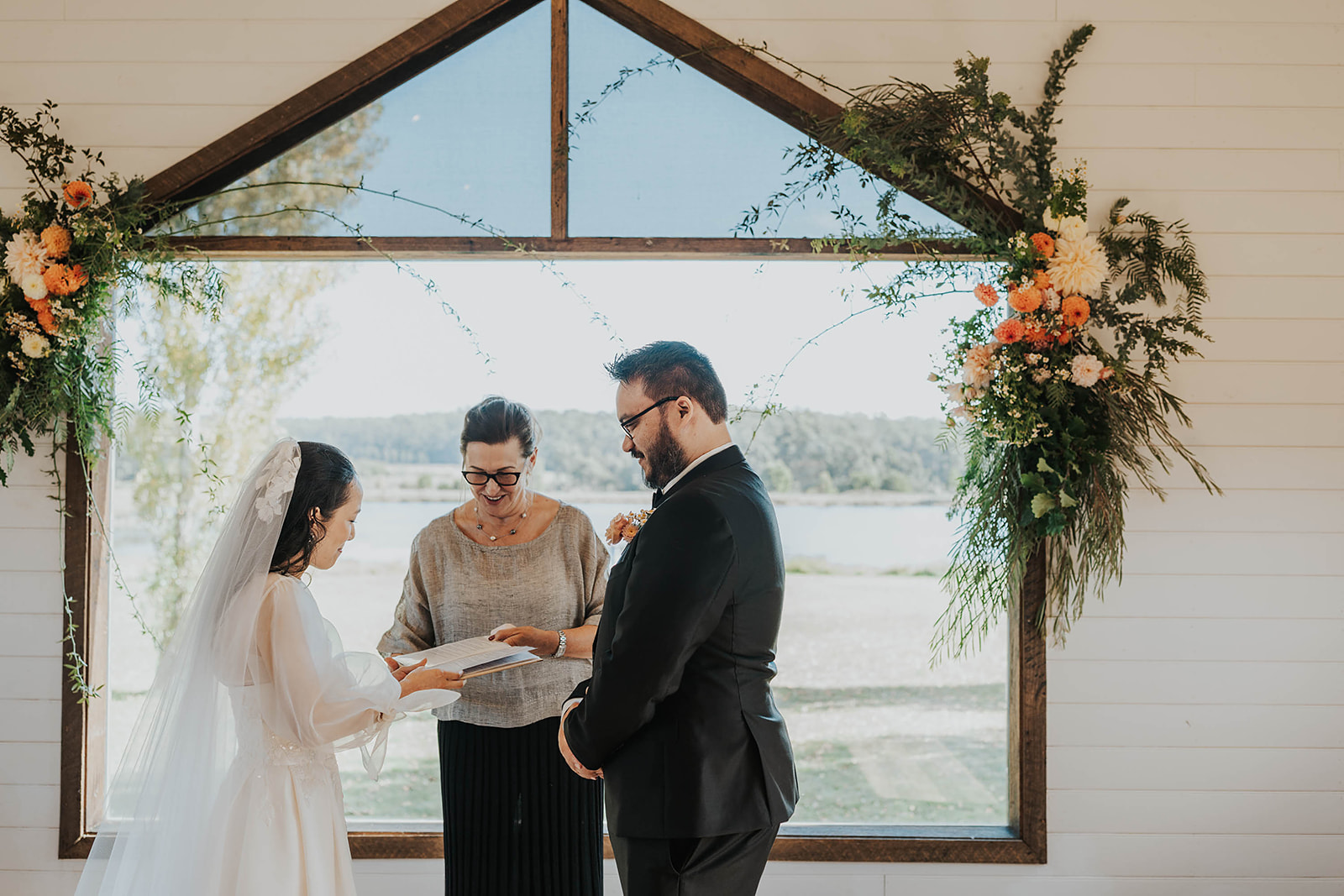The bride and groom share their vows with their celebrant during an intimate ceremony at Sault, Daylesford.