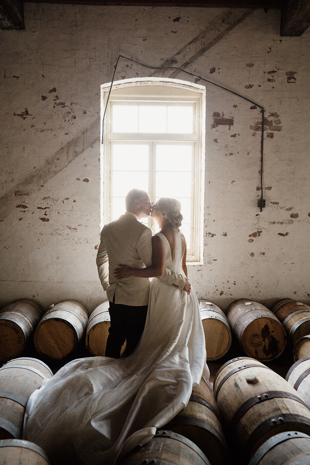 Bride and groom photo in the barrel room at Corowa Whisky and Chocolate. Wedding photo at Corowa Whisky and Chocolate. 