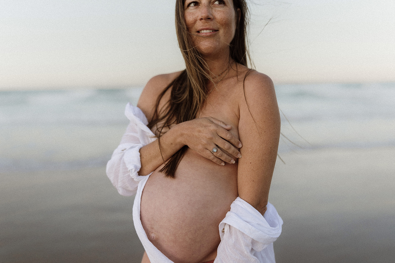 Pregnant woman at a maternity session on the beach on the Gold Coast