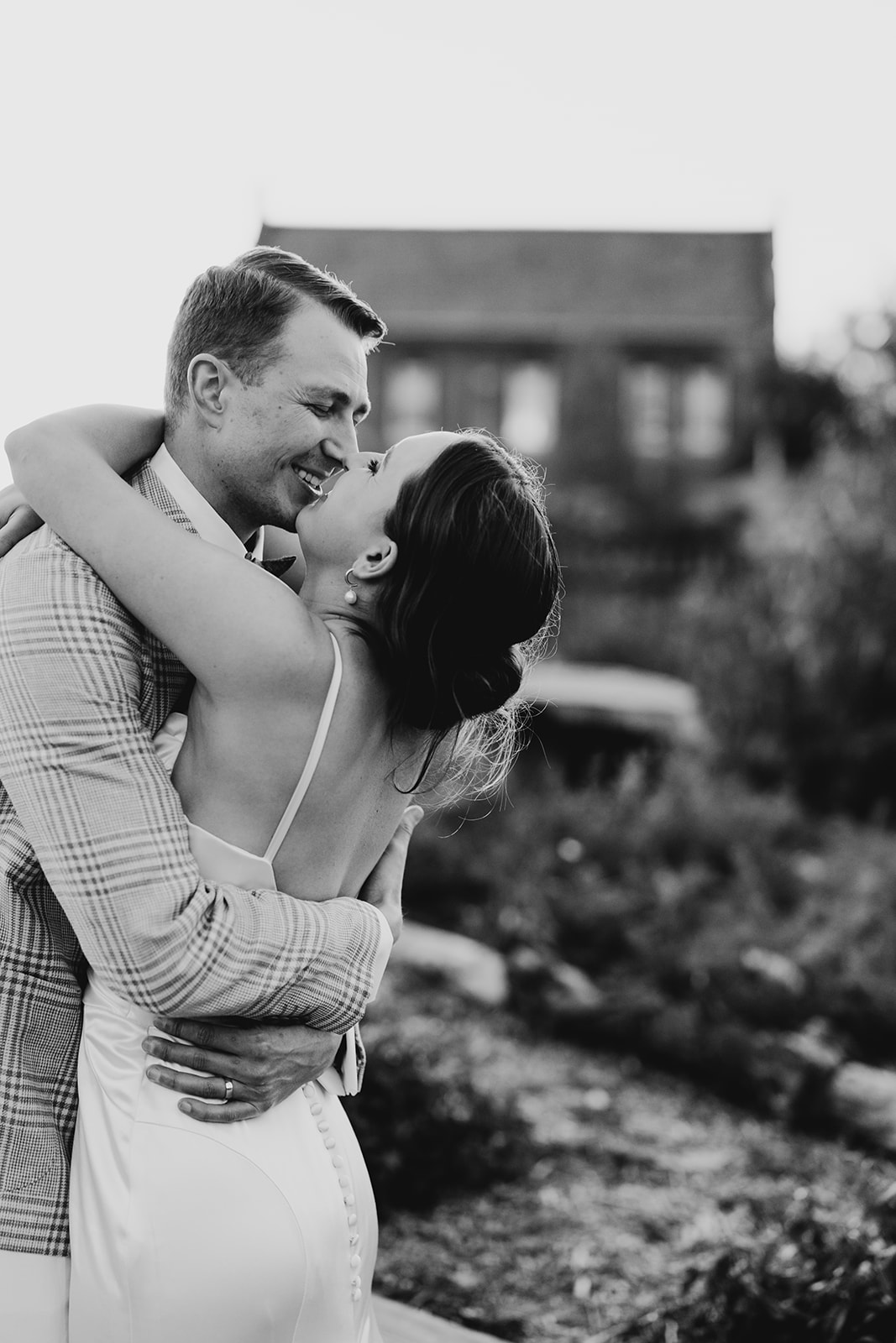 Black and white of couple basking in the bliss of just getting married. Collingwood wedding inspiration 