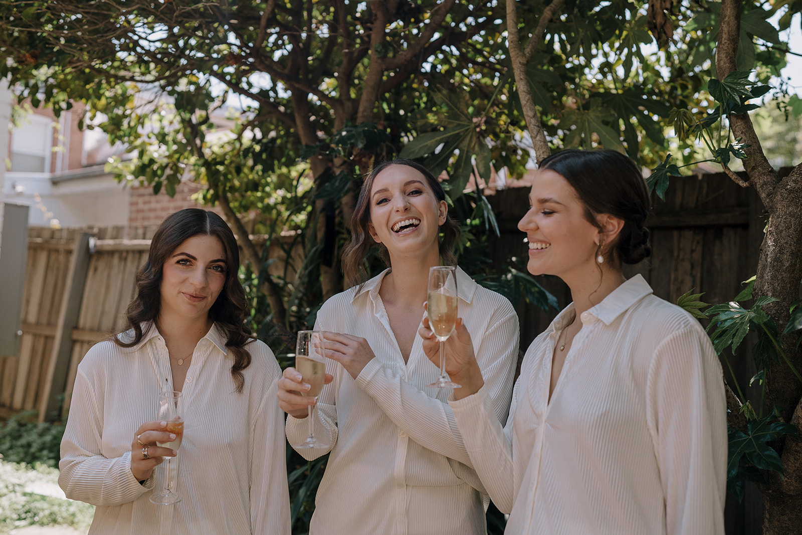 Bride with bridesmaids enjoying Champagne