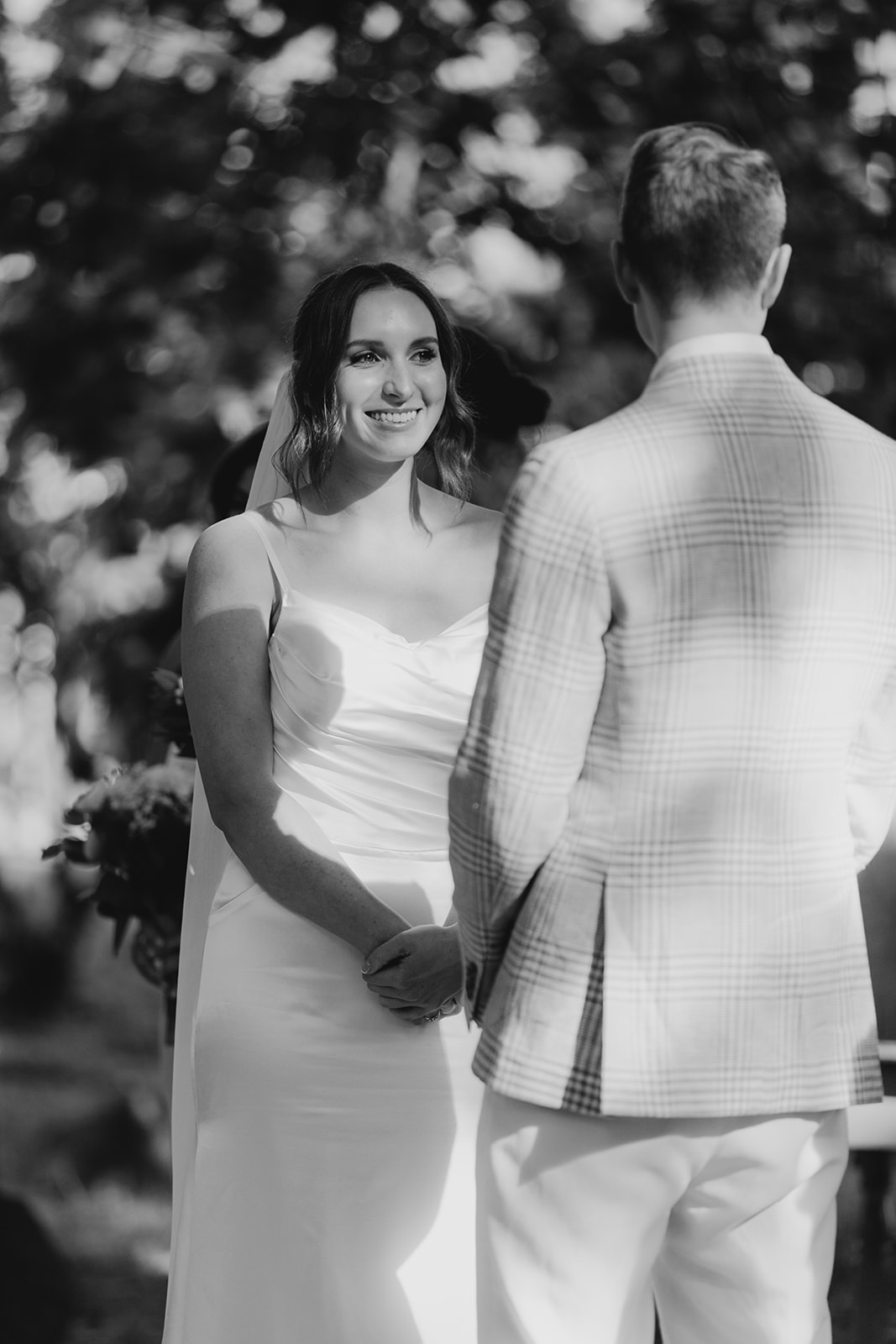 Bride gazes into her husband to be at there Collingwood children's farm wedding venue