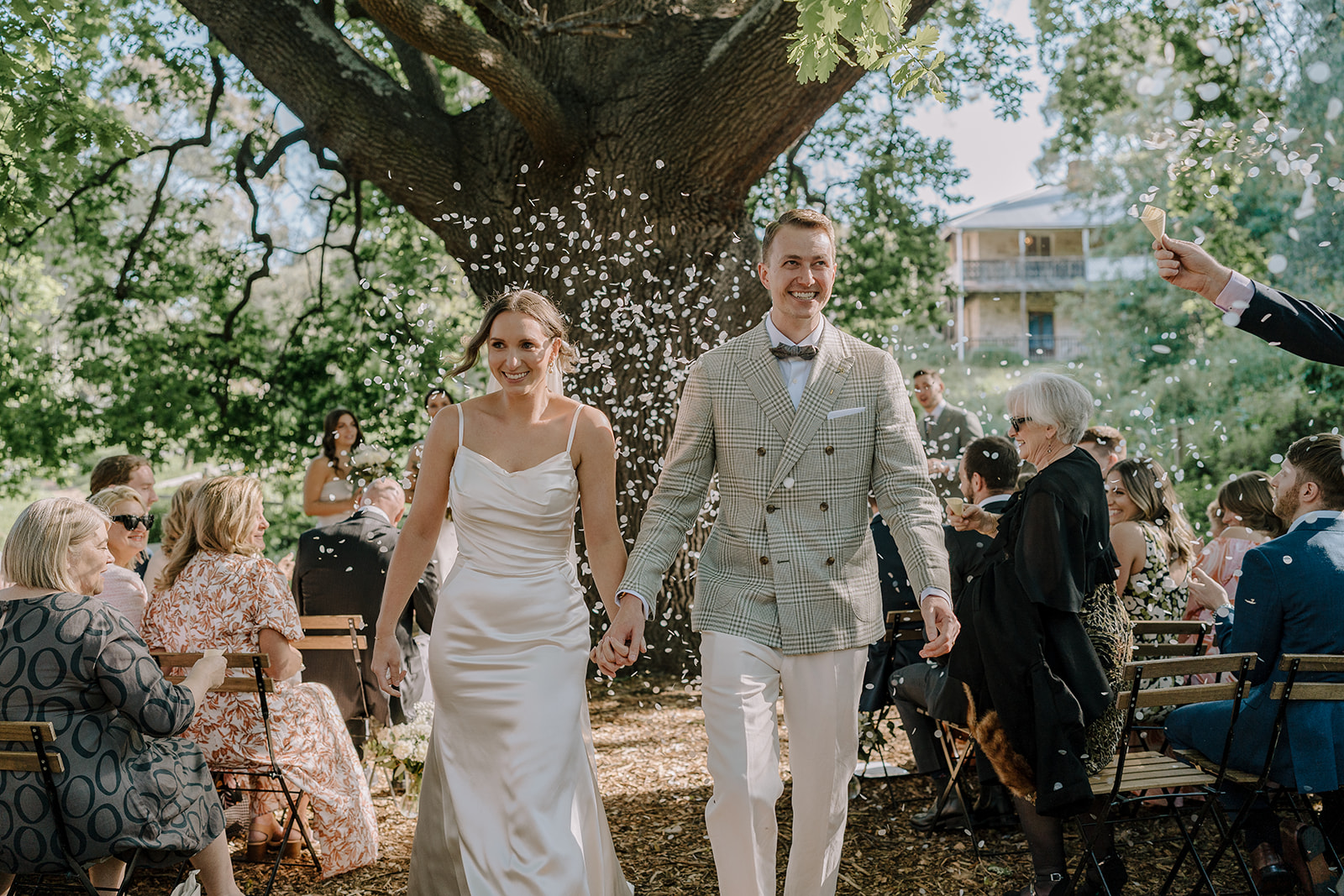 Just married couple walk down the aisle at there inner-city farm wedding venue in Collingwood 