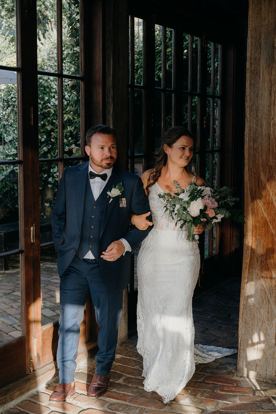 couple enter mudbrick wedding venue on waiheke resturant