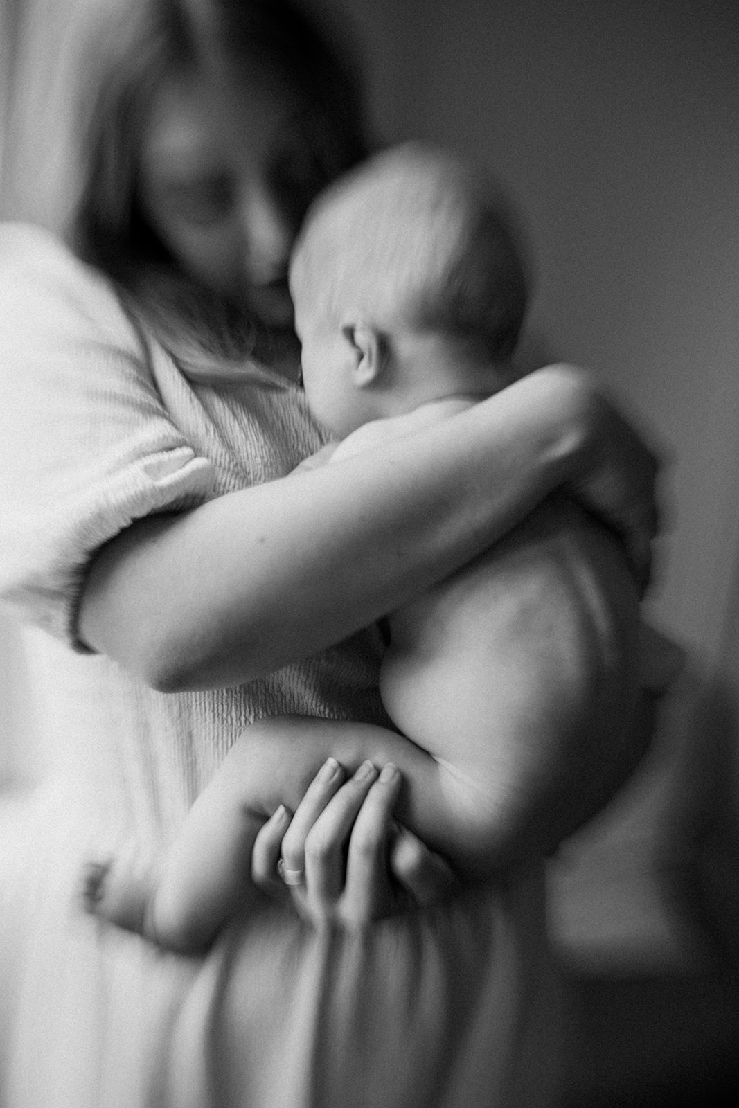 a blurry image of a mother holding her wriggly baby