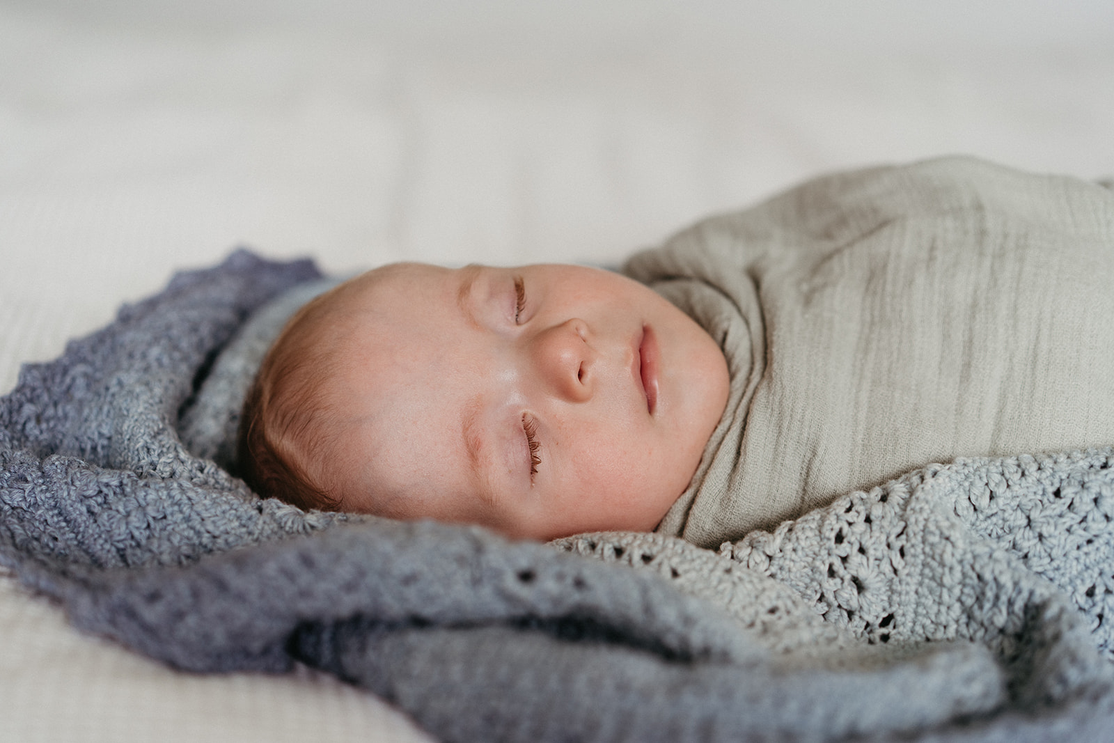 a wrapped baby sleeping