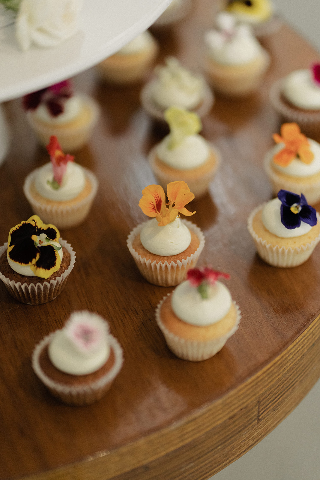 Summergrove Estate Wedding photography Reception bright delicate florals on minimal cupcake cake