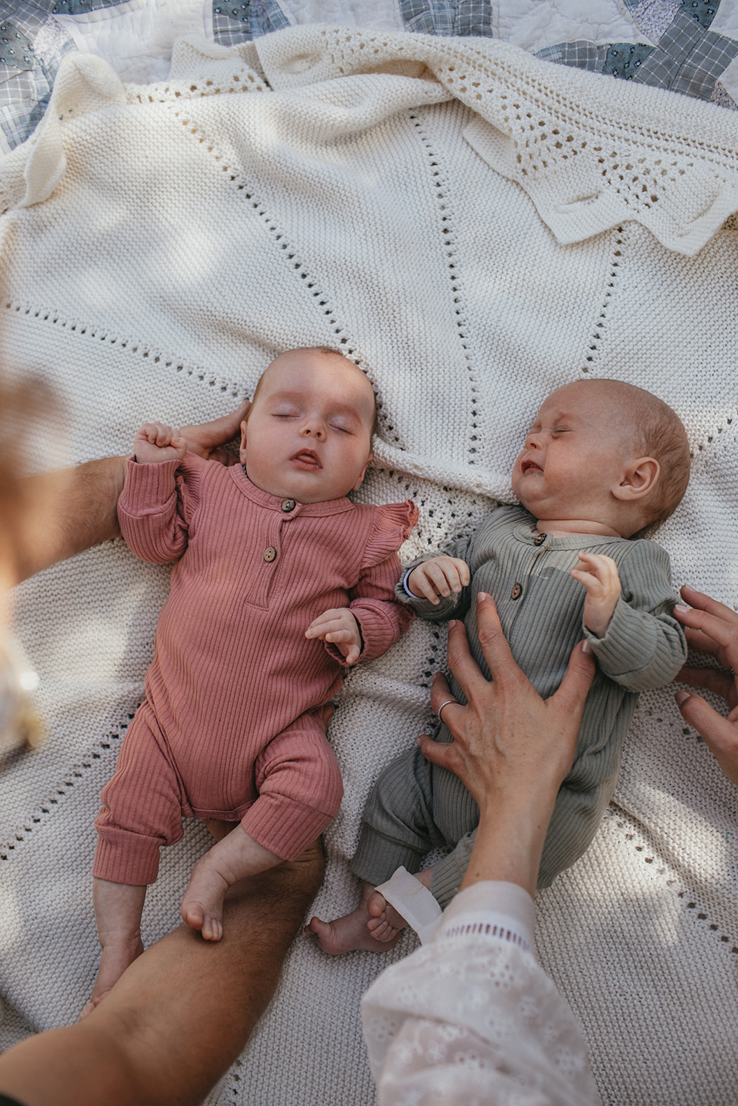 Parents lie twins down for newborn photos in Christchurch