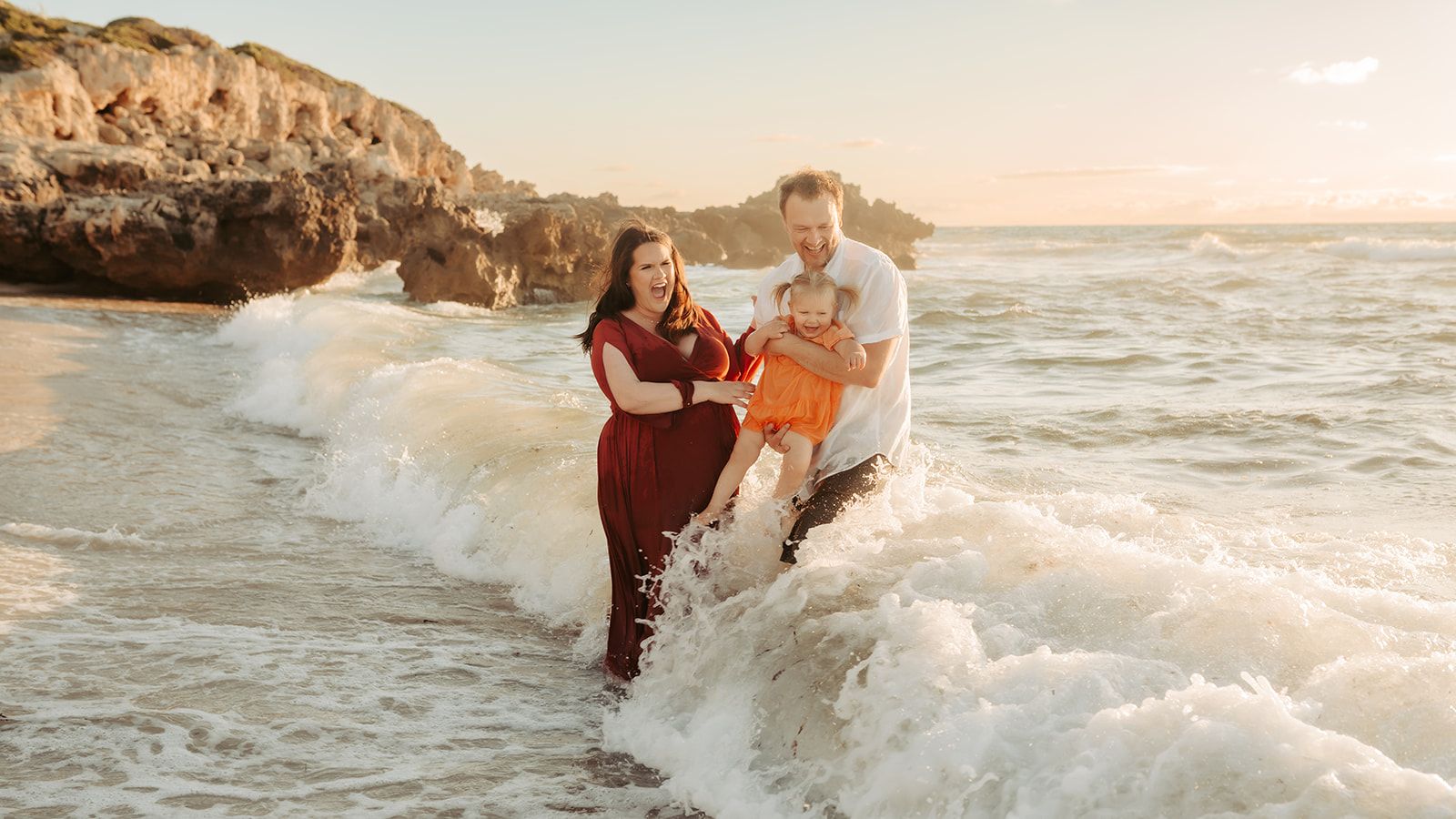 A fun maternity photography session in the water at one of Perth's best beaches.