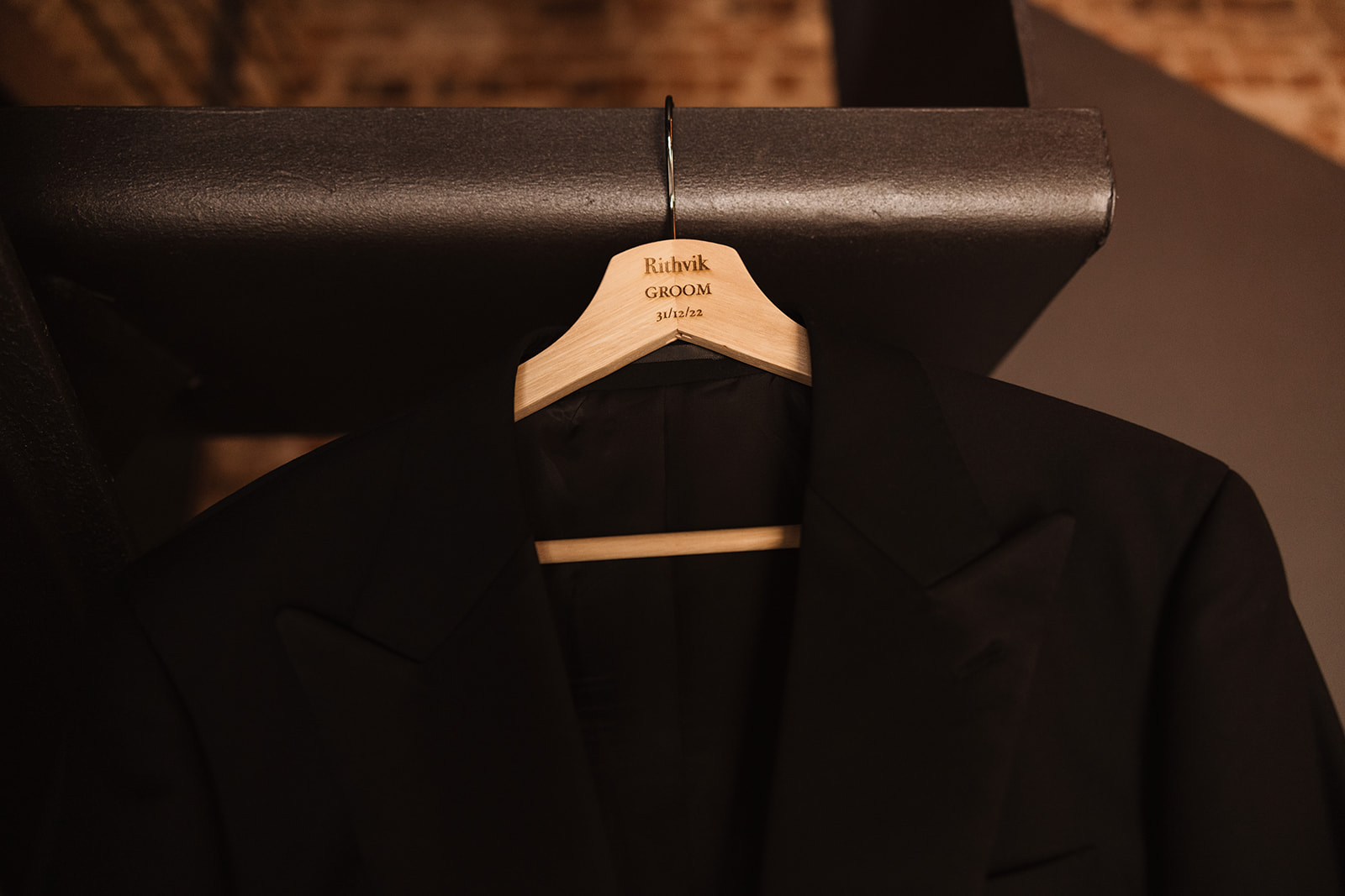Groom black suit hanging in the room at the Wedding in Mona Farm Braidwood, New South Wales