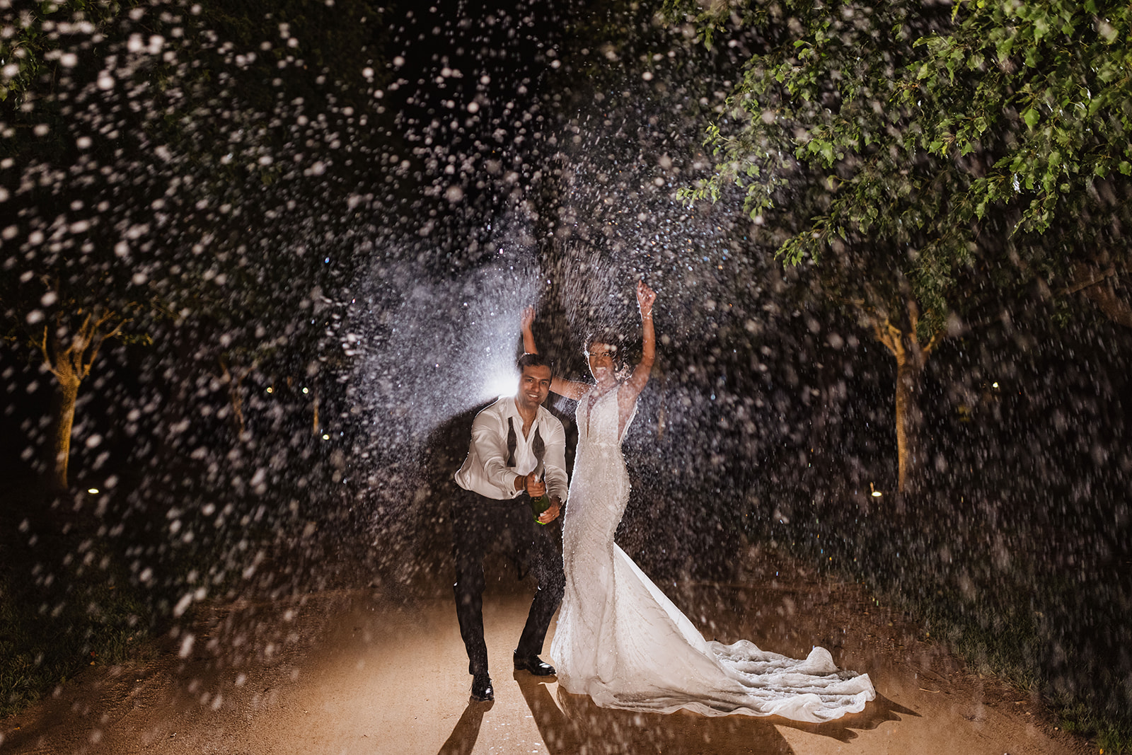 Nigh time champagne shower at the Wedding in Mona Farm Braidwood, New South Wales