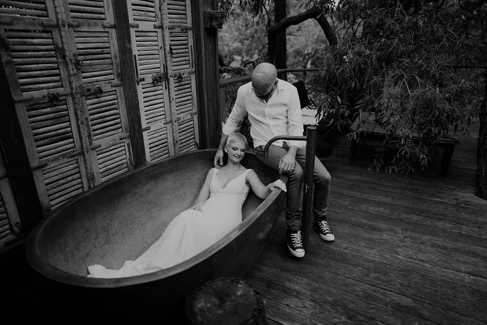 Bride and groom, having fun in an outdoor bathtub in Kangaroo Valley