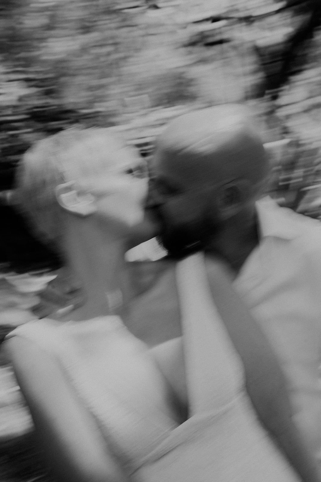 An intimate black-and-white blurred image of a bride and groom in Kangaroo Valley