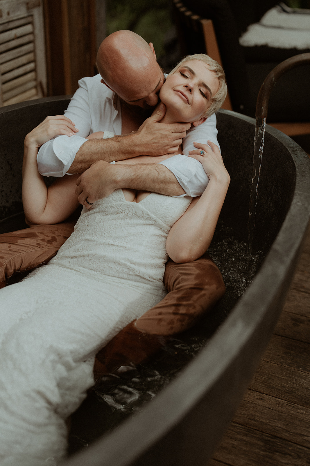 An intimate image of a Bride and groom in an outdoor bathtub in Kangaroo Valley