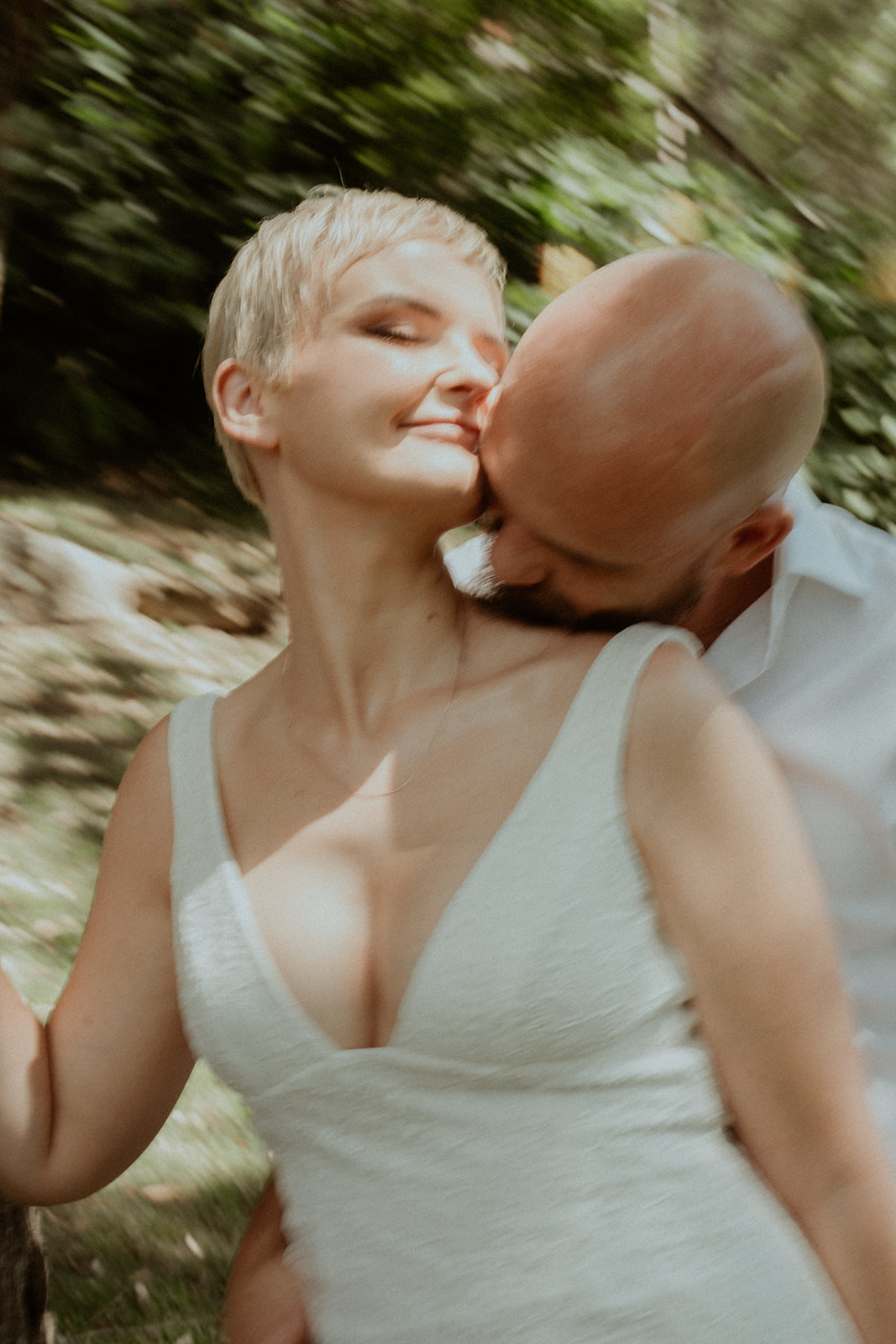 And intimate image of a groom, kissing the bride's neck in Kangaroo Valley