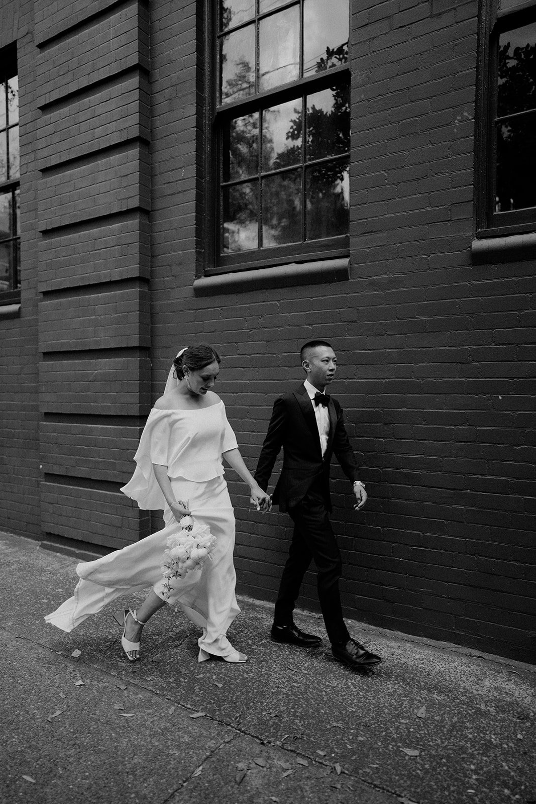 Bride and groom, walking down the street in Sydney