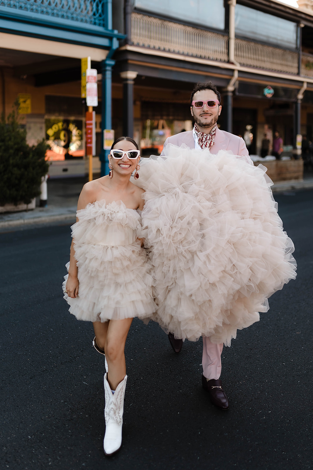 Bride and groom wearing Kyha Studios and Knightman tailored suit walking to Adelaide Fringe