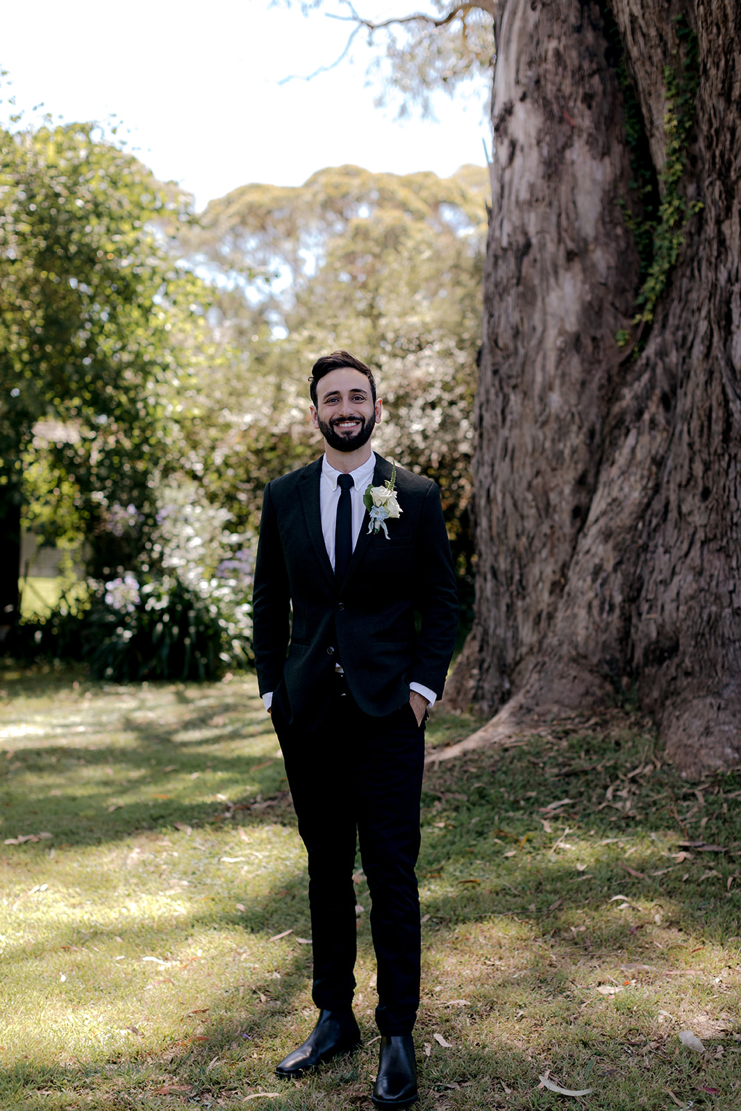 Portrait of groom on his elegant country wedding day.
