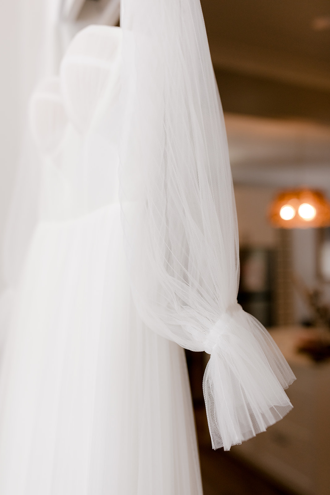 Close-up of elegant wedding gown sleeve.