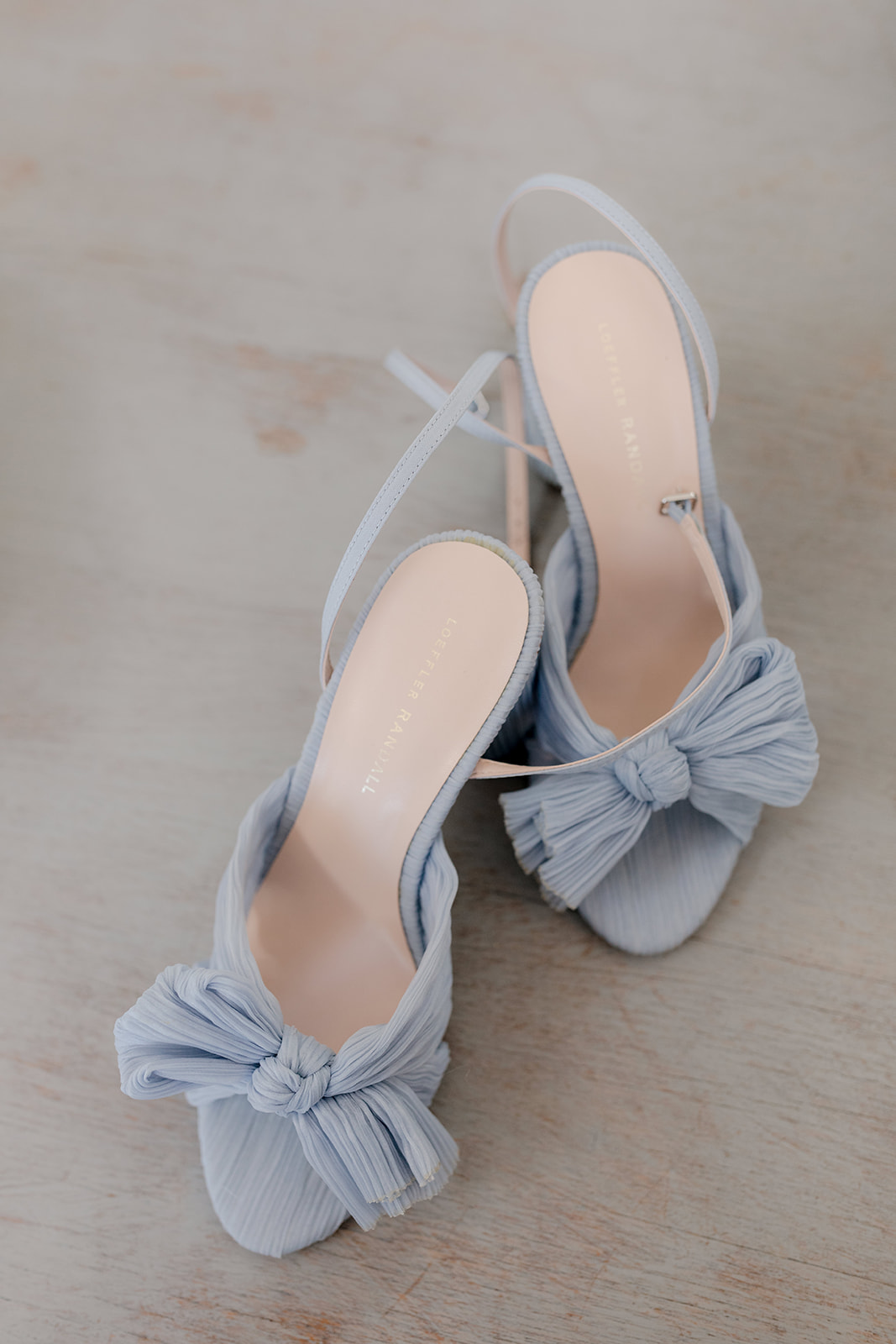 Close-up of chic baby blue bridal shoes for an elegant country wedding.