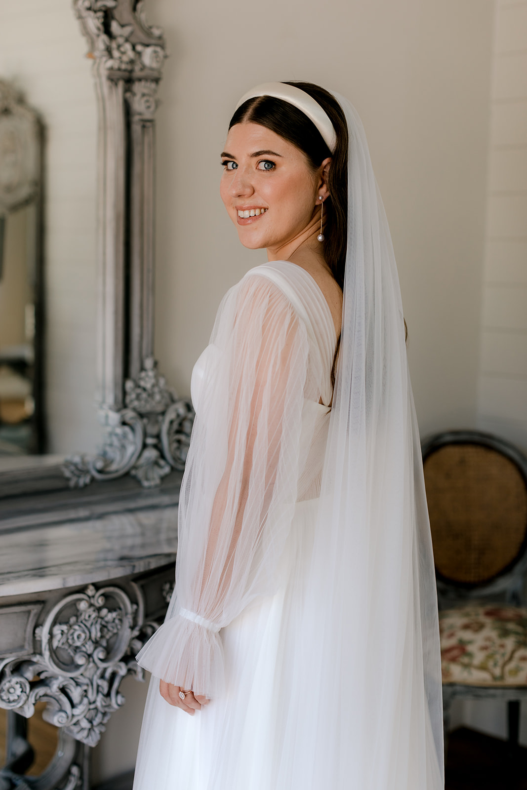 Portrait of bride getting ready for her elegant country wedding.