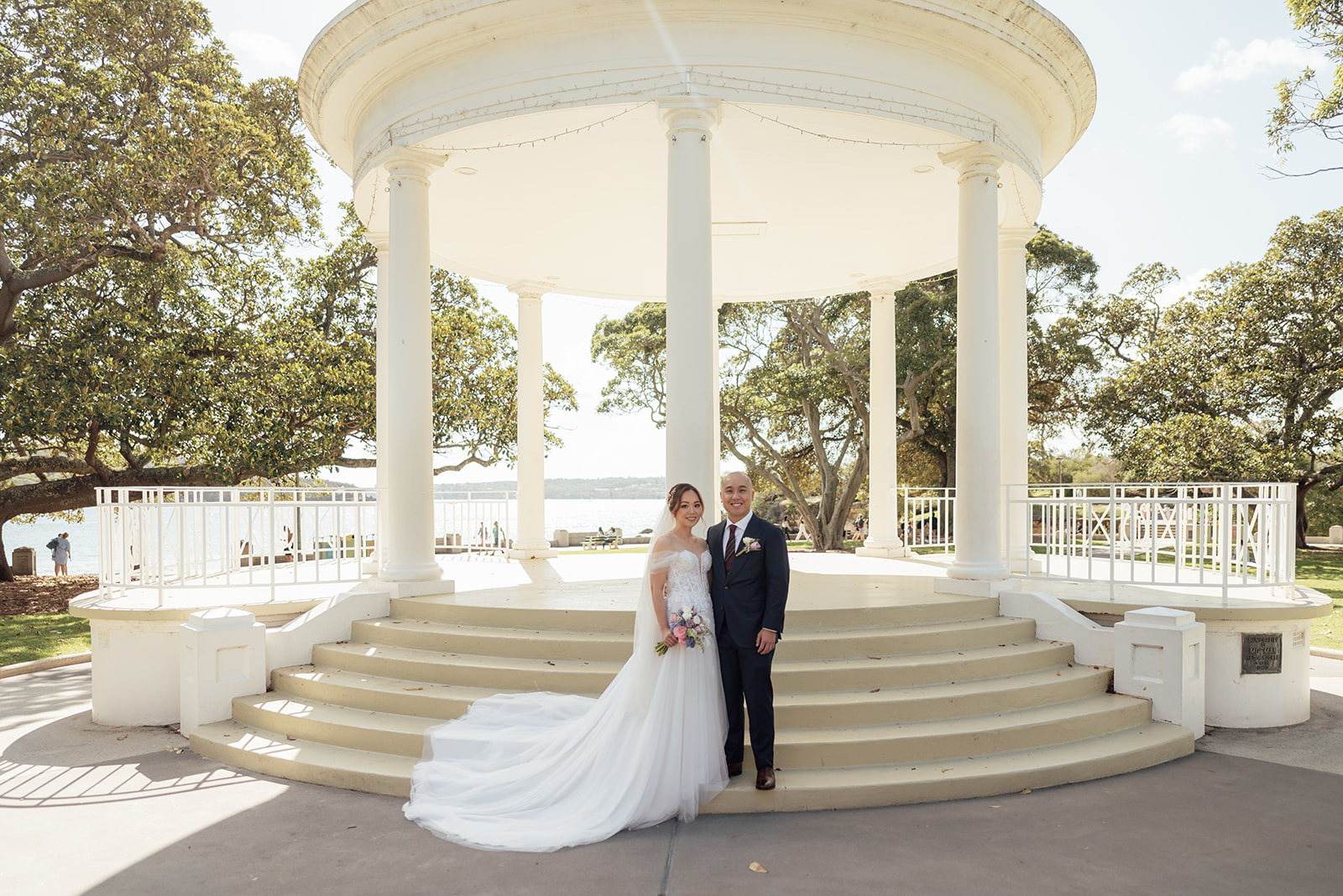couple standing at the rotunda at balmoral beach