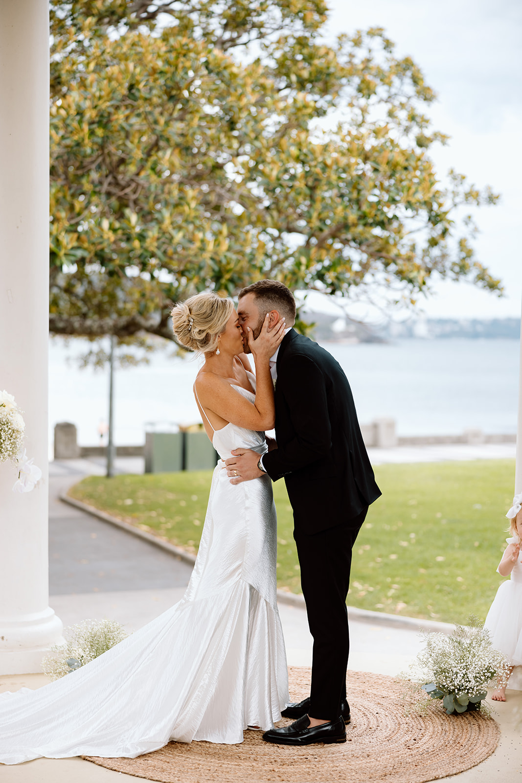 Bride and groom first kiss at the wedding in The Fernery Mosman