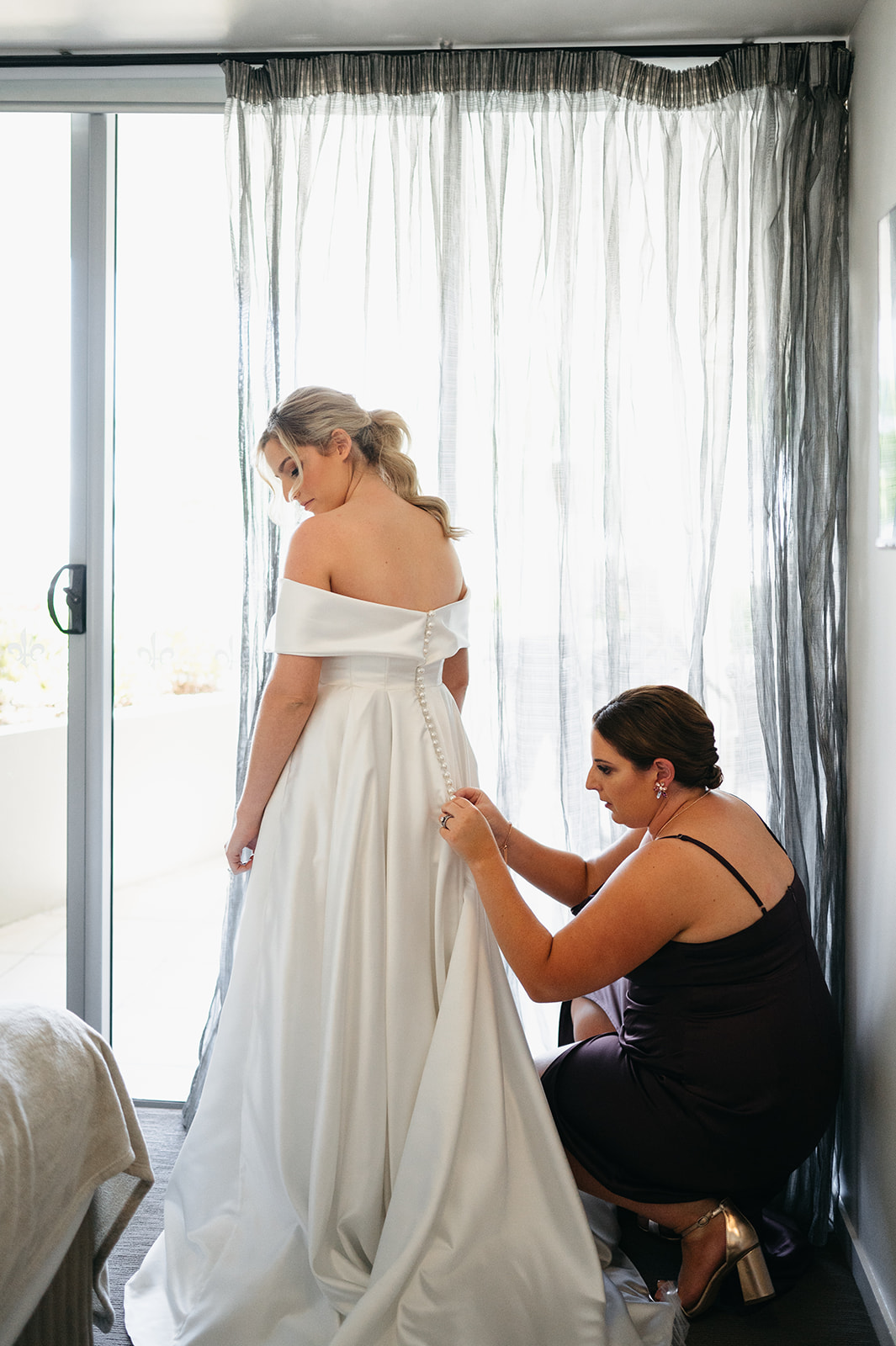 bride getting ready in dress before Cairns church wedding