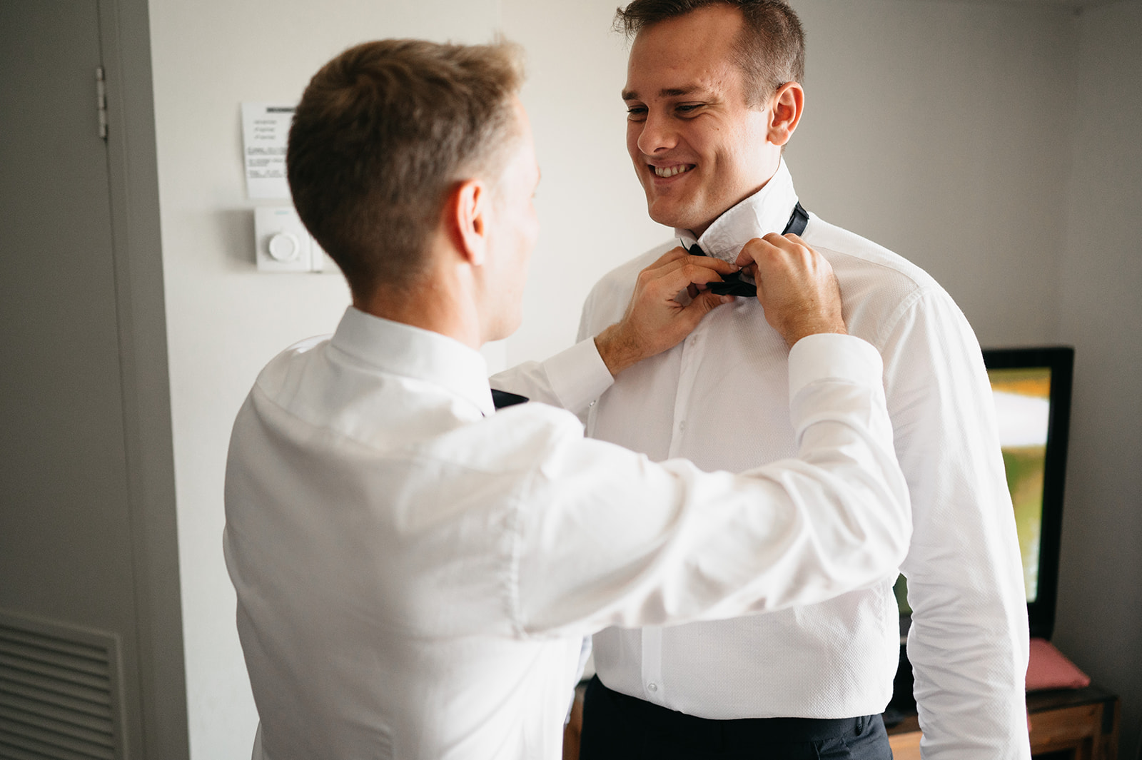 groom getting ready with groomsmen in cairns