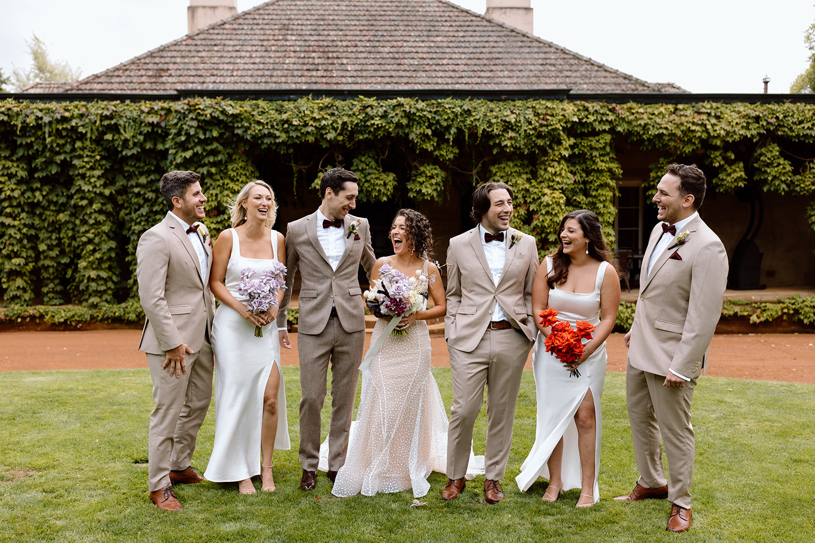 Couple together with their bridal party at the wedding in the Southern Highlands Bendooley Estate