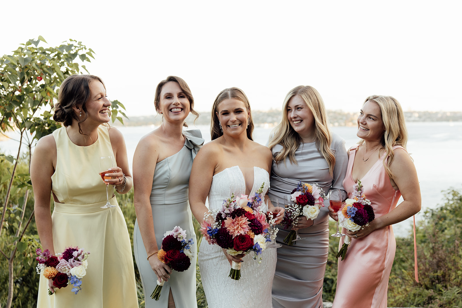 A bride and her bridesmaids laughing