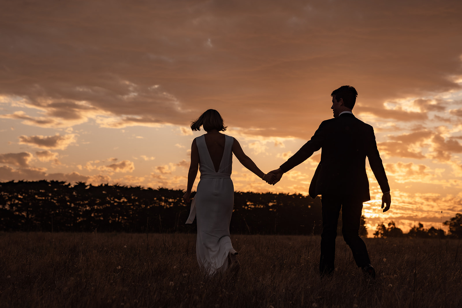 Wedding couple in front of a sunset on the Bellarine.