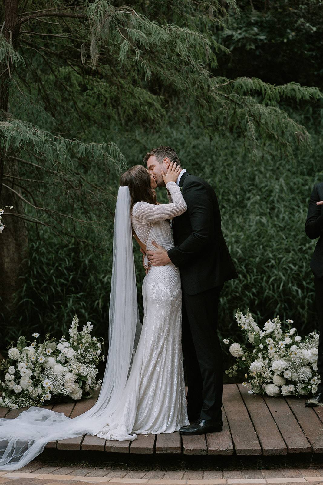 First kiss during the ceremony of Izzy and Rhys at Bundaleer Rainforest Gardens.