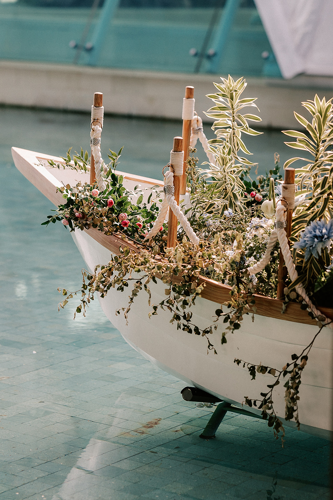 boat covered in flowers in the water