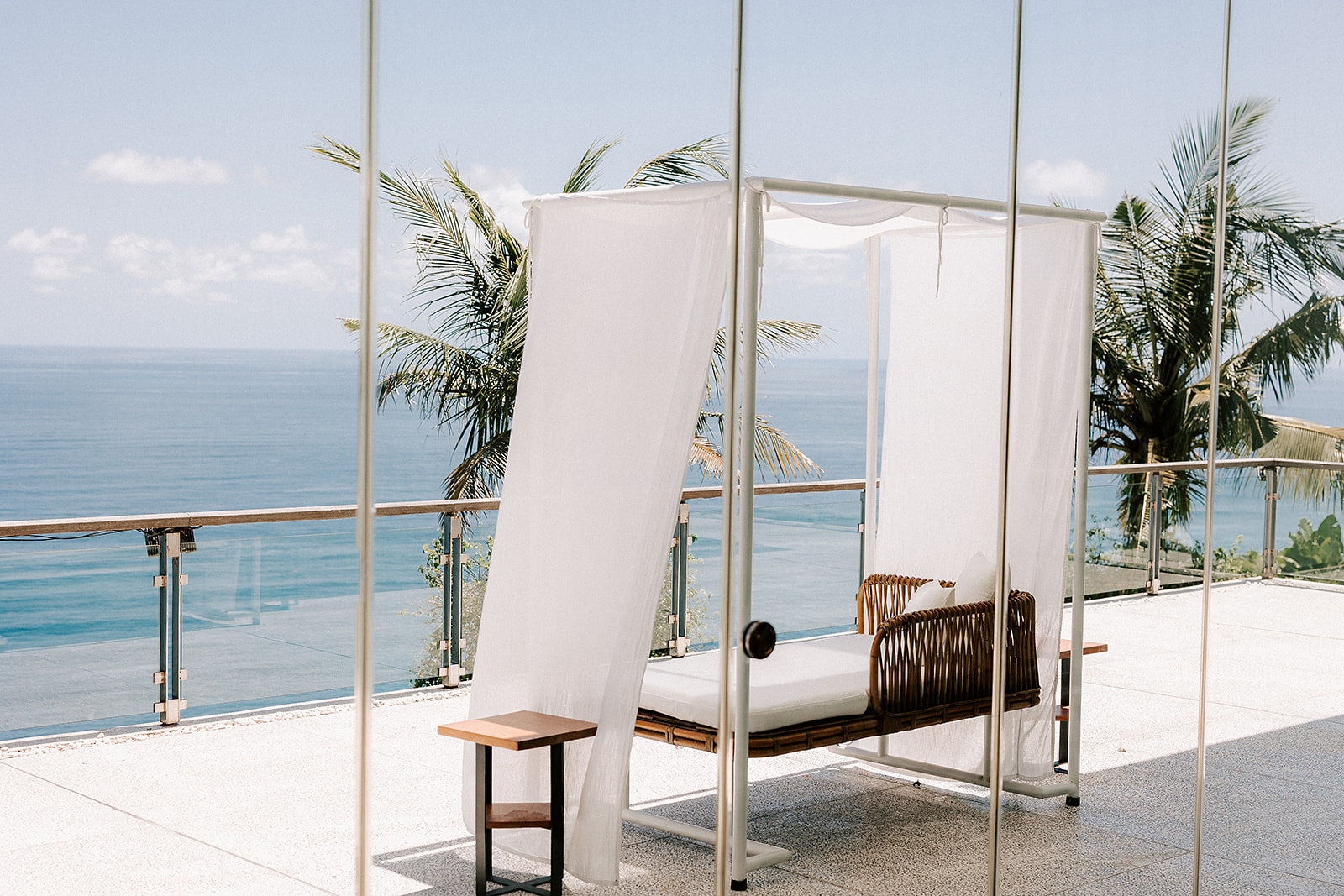 a canopied deck chair overlooking the waters from the clifftops in Uluwatu