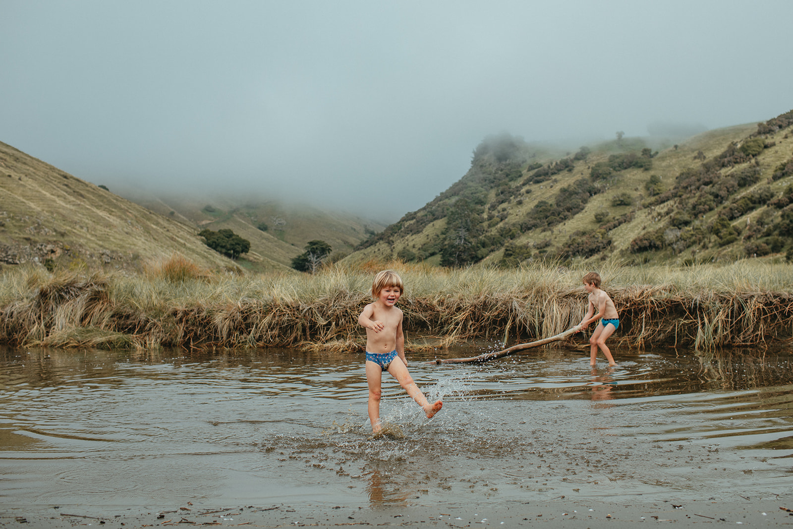 Kids play at Raupo Bay, Banks Peninsula