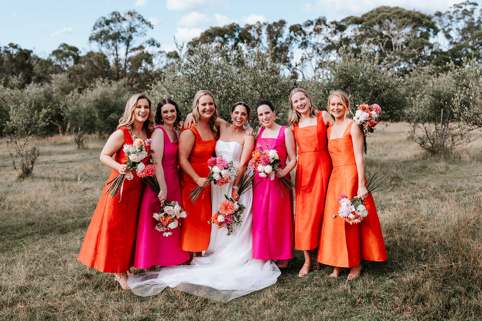 Bride and bridesmaids standing together