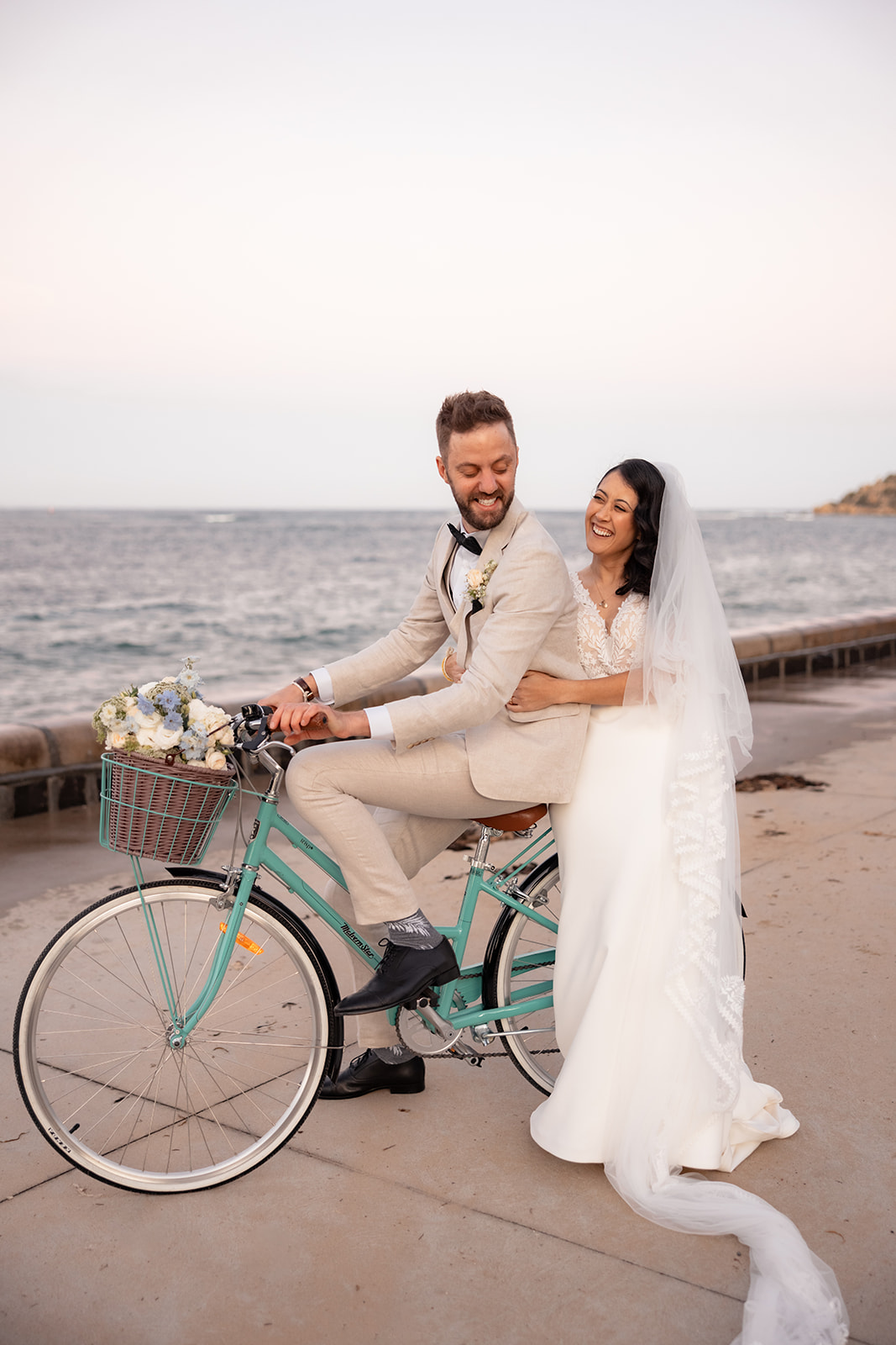 Wedding couple on a bicycle in Barwon Heads