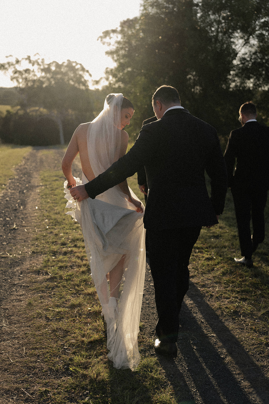 An elegant candid of a couple walking at  their wedding at Sirromet Wines in Brisbane