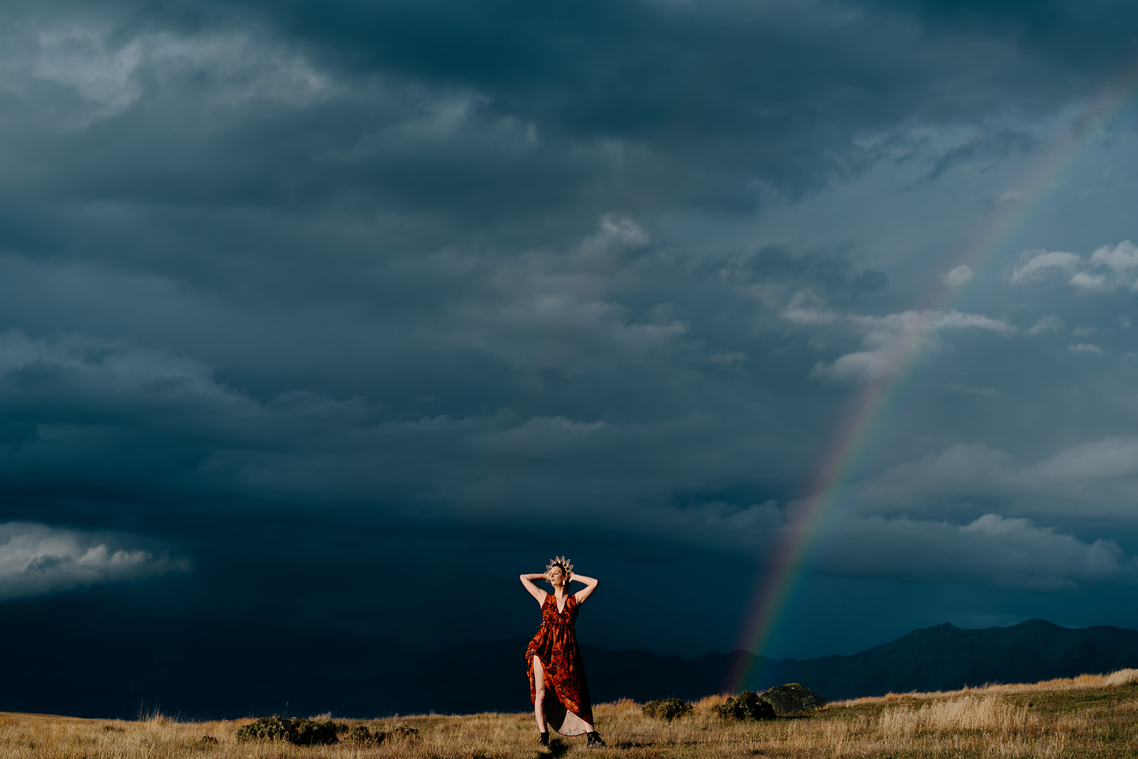 Fashion Photoshoot Adventure at Lake Tekapo with rainbows and dark skies