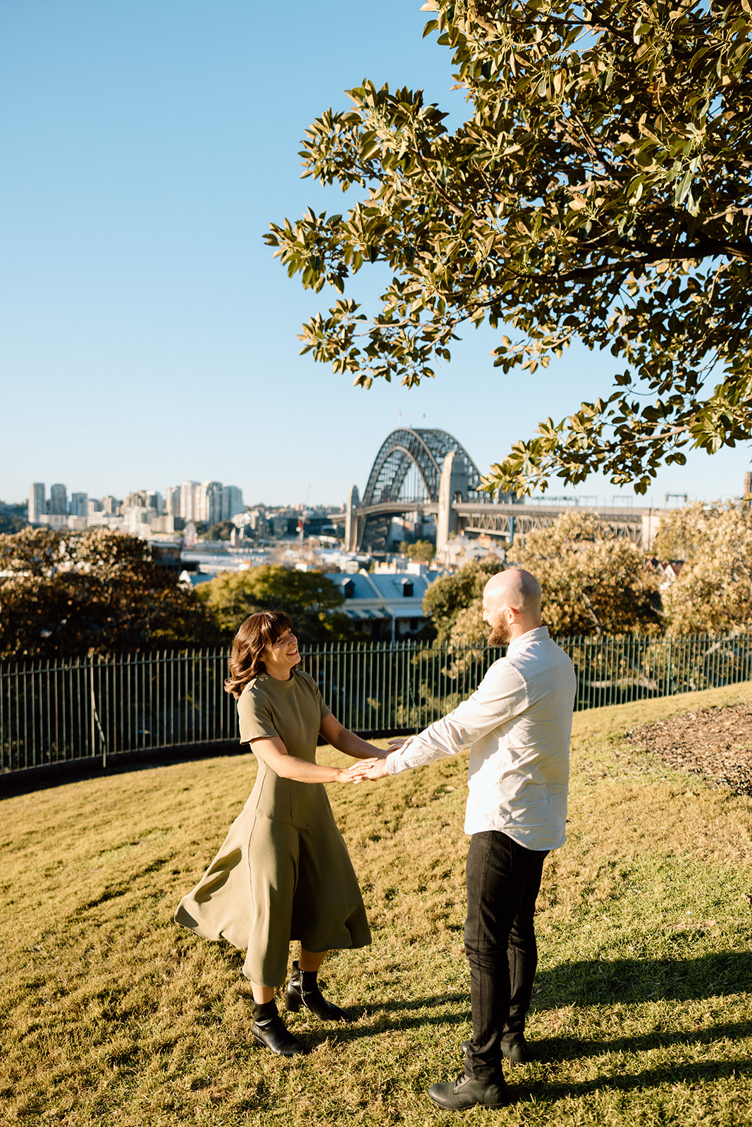 Couple happily looking at each other at their engagement shoot in Sydney CBD
