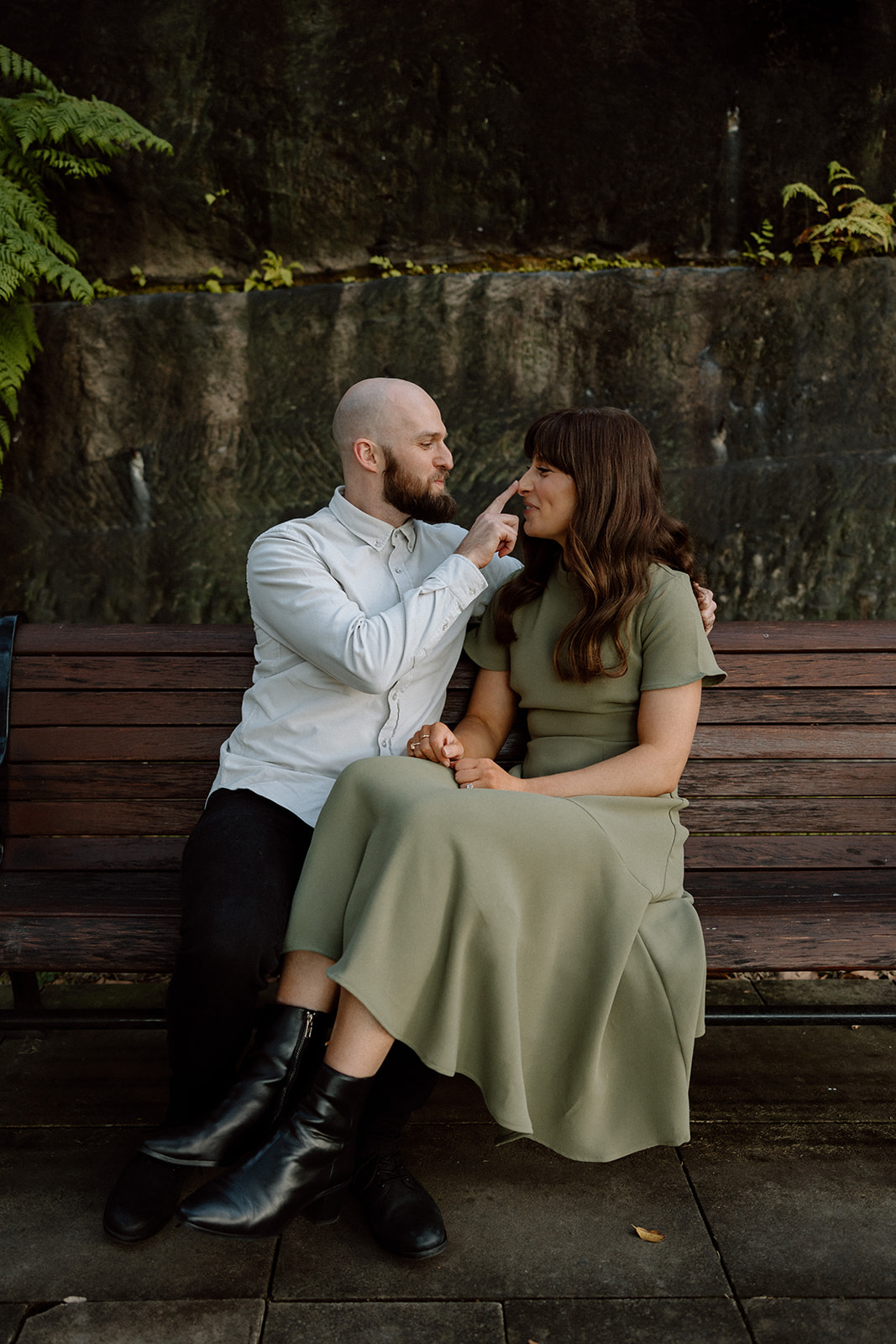 Couple happily looking at each other at their engagement shoot in Sydney CBD