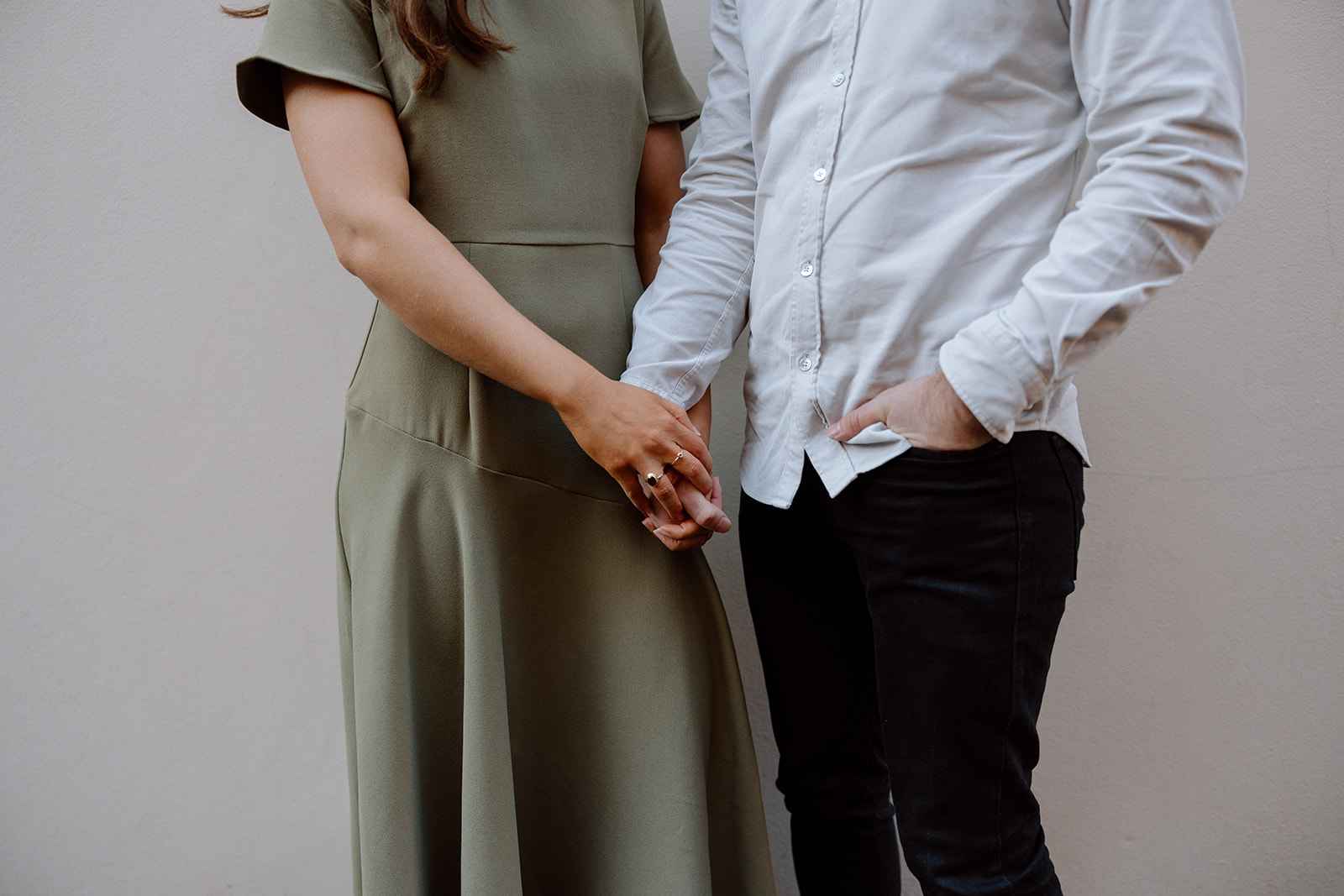 Couple holding hands at their engagement shoot in Sydney CBD